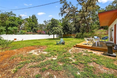 Come see this well-maintained 3-bedroom, 2.5-bath midcentury on Temple Terrace Golf and Country Club in Florida - for sale on GolfHomes.com, golf home, golf lot
