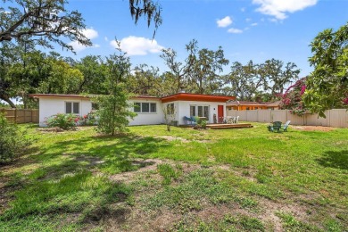 Come see this well-maintained 3-bedroom, 2.5-bath midcentury on Temple Terrace Golf and Country Club in Florida - for sale on GolfHomes.com, golf home, golf lot