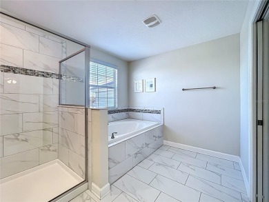 WALKING DISTANCE TO THE CLUBHOUSE. This beautifully designed on The Oasis Club at Champions Gate in Florida - for sale on GolfHomes.com, golf home, golf lot
