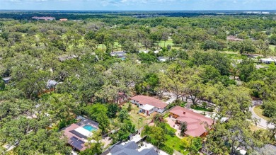 Come see this well-maintained 3-bedroom, 2.5-bath midcentury on Temple Terrace Golf and Country Club in Florida - for sale on GolfHomes.com, golf home, golf lot