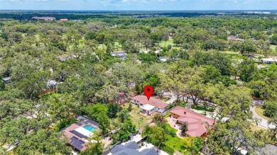 Come see this well-maintained 3-bedroom, 2.5-bath midcentury on Temple Terrace Golf and Country Club in Florida - for sale on GolfHomes.com, golf home, golf lot