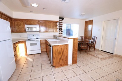 Discover easy desert living in this well-kept 2-bedroom, 2-bath on Foothills Executive Golf Course in Arizona - for sale on GolfHomes.com, golf home, golf lot