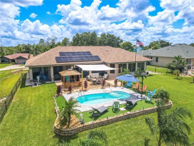 Welcome to this exceptional custom-built Alexander home on Oak Hills Country Club in Florida - for sale on GolfHomes.com, golf home, golf lot