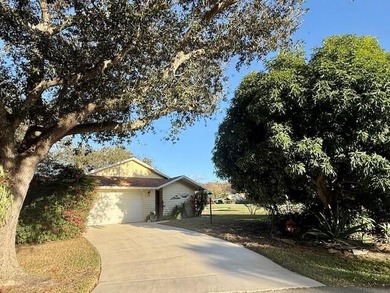 Beautifully maintained cul-de-sac home with peaceful woods and on Eagle Wood Golf Course in Florida - for sale on GolfHomes.com, golf home, golf lot