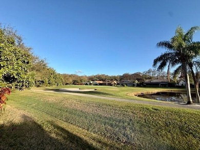 Beautifully maintained cul-de-sac home with peaceful woods and on Eagle Wood Golf Course in Florida - for sale on GolfHomes.com, golf home, golf lot