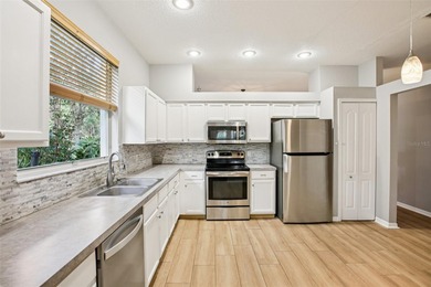 An EXCEPTIONAL VALUE in one of New Tampa's most sought-after on Hunters Green Country Club in Florida - for sale on GolfHomes.com, golf home, golf lot