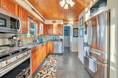 INCREDIBLE WATERFRONT WONDERLAND in Captain's Cove Golf & Yacht on Captains Cove Golf and Yacht Club in Virginia - for sale on GolfHomes.com, golf home, golf lot