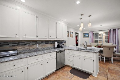This beautifully maintained 4-bedroom, 2-bath gem nestled in the on Annandale Golf Club in Mississippi - for sale on GolfHomes.com, golf home, golf lot