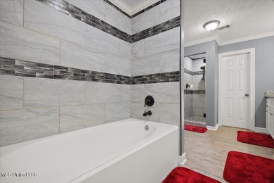 This beautifully maintained 4-bedroom, 2-bath gem nestled in the on Annandale Golf Club in Mississippi - for sale on GolfHomes.com, golf home, golf lot