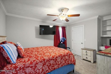 This beautifully maintained 4-bedroom, 2-bath gem nestled in the on Annandale Golf Club in Mississippi - for sale on GolfHomes.com, golf home, golf lot