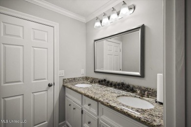 This beautifully maintained 4-bedroom, 2-bath gem nestled in the on Annandale Golf Club in Mississippi - for sale on GolfHomes.com, golf home, golf lot