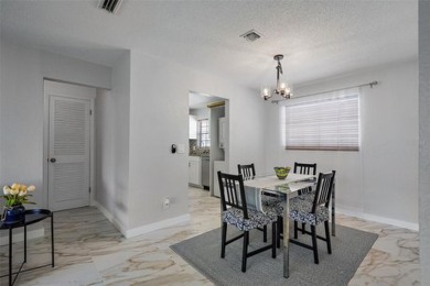 Welcome to 200 Country Club Dr #1004, Largo, FL 33771! This on East Bay Golf Club in Florida - for sale on GolfHomes.com, golf home, golf lot