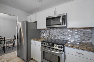 Welcome to 200 Country Club Dr #1004, Largo, FL 33771! This on East Bay Golf Club in Florida - for sale on GolfHomes.com, golf home, golf lot