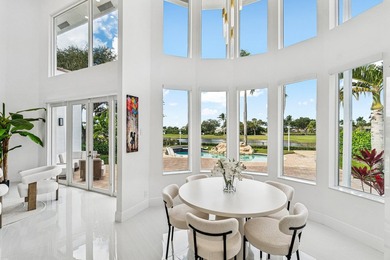 A striking, newly renovated two-story residence showcasing on  in Florida - for sale on GolfHomes.com, golf home, golf lot