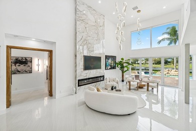 A striking, newly renovated two-story residence showcasing on  in Florida - for sale on GolfHomes.com, golf home, golf lot