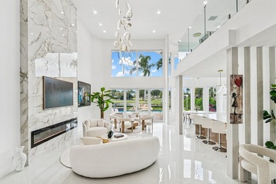 A striking, newly renovated two-story residence showcasing on  in Florida - for sale on GolfHomes.com, golf home, golf lot