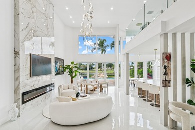 A striking, newly renovated two-story residence showcasing on Polo Club of Boca Raton in Florida - for sale on GolfHomes.com, golf home, golf lot