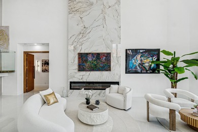 A striking, newly renovated two-story residence showcasing on Polo Club of Boca Raton in Florida - for sale on GolfHomes.com, golf home, golf lot