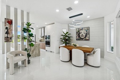 A striking, newly renovated two-story residence showcasing on  in Florida - for sale on GolfHomes.com, golf home, golf lot
