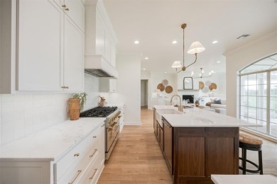 Welcome to this stunning single-story residence where modern on Oak Tree National Golf and Country Club in Oklahoma - for sale on GolfHomes.com, golf home, golf lot