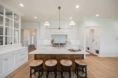 Welcome to this stunning single-story residence where modern on Oak Tree National Golf and Country Club in Oklahoma - for sale on GolfHomes.com, golf home, golf lot