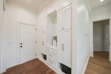 Welcome to this stunning single-story residence where modern on Oak Tree National Golf and Country Club in Oklahoma - for sale on GolfHomes.com, golf home, golf lot