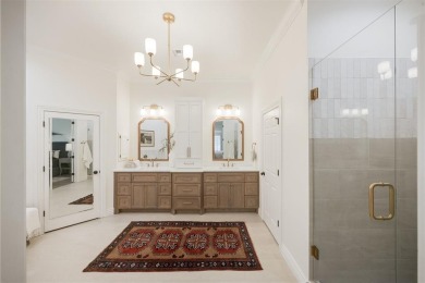 Welcome to this stunning single-story residence where modern on Oak Tree National Golf and Country Club in Oklahoma - for sale on GolfHomes.com, golf home, golf lot