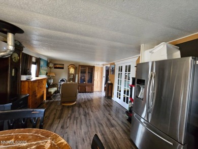 Welcome to 11 Mariposa Way, a charming home located in the heart on Round Mountain Golf Club in Nevada - for sale on GolfHomes.com, golf home, golf lot