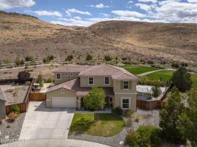 The spacious primary suite includes a private balcony where you on DAndrea Golf Club in Nevada - for sale on GolfHomes.com, golf home, golf lot