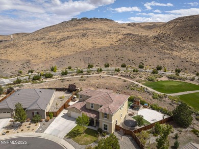 The spacious primary suite includes a private balcony where you on DAndrea Golf Club in Nevada - for sale on GolfHomes.com, golf home, golf lot