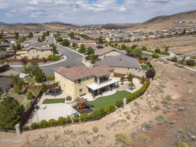 The spacious primary suite includes a private balcony where you on DAndrea Golf Club in Nevada - for sale on GolfHomes.com, golf home, golf lot