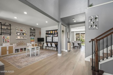 The spacious primary suite includes a private balcony where you on DAndrea Golf Club in Nevada - for sale on GolfHomes.com, golf home, golf lot