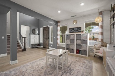The spacious primary suite includes a private balcony where you on DAndrea Golf Club in Nevada - for sale on GolfHomes.com, golf home, golf lot