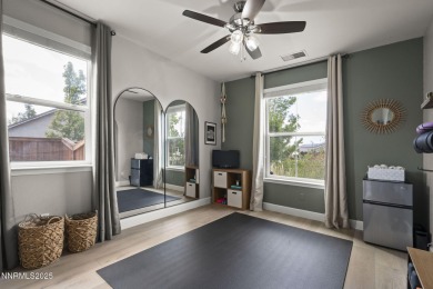 The spacious primary suite includes a private balcony where you on DAndrea Golf Club in Nevada - for sale on GolfHomes.com, golf home, golf lot