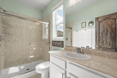 The spacious primary suite includes a private balcony where you on DAndrea Golf Club in Nevada - for sale on GolfHomes.com, golf home, golf lot