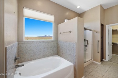 Views, views, views!! This home is nestled between the Quailwood on Quail Wood Greens Golf Course in Arizona - for sale on GolfHomes.com, golf home, golf lot
