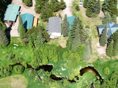 Located on a quiet half-acre lot with 100 feet of Lamb Creek on Priest Lake Golf and Tennis Club in Idaho - for sale on GolfHomes.com, golf home, golf lot