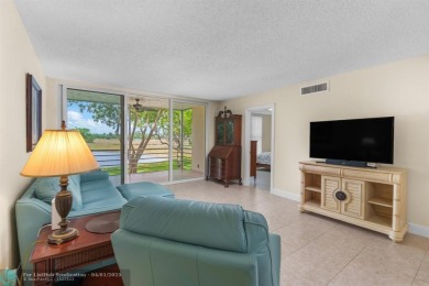 Enjoy a Serene Lake View from this Super Clean, Bright 2nd Floor on Palm-Aire Country Club and Resort - Palms in Florida - for sale on GolfHomes.com, golf home, golf lot