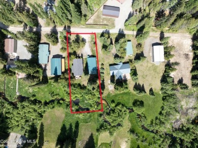 Located on a quiet half-acre lot with 100 feet of Lamb Creek on Priest Lake Golf and Tennis Club in Idaho - for sale on GolfHomes.com, golf home, golf lot