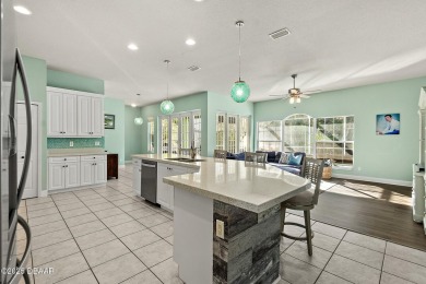 Welcome to this beautifully maintained 4-bedroom, 2-bathroom on Plantation Bay Golf and Country Club in Florida - for sale on GolfHomes.com, golf home, golf lot