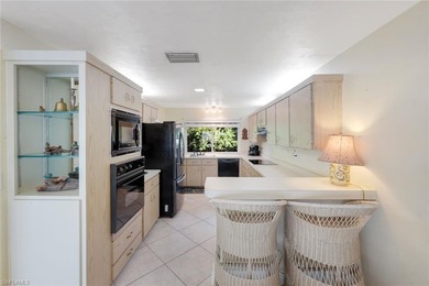 Nestled within the gated community of Spanish Wells in Bonita on Spanish Wells Golf and Country Club in Florida - for sale on GolfHomes.com, golf home, golf lot
