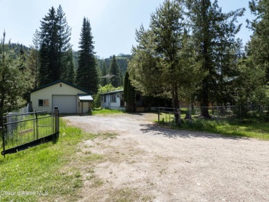 Located on a quiet half-acre lot with 100 feet of Lamb Creek on Priest Lake Golf and Tennis Club in Idaho - for sale on GolfHomes.com, golf home, golf lot