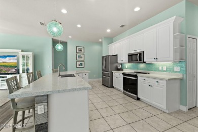 Welcome to this beautifully maintained 4-bedroom, 2-bathroom on Plantation Bay Golf and Country Club in Florida - for sale on GolfHomes.com, golf home, golf lot