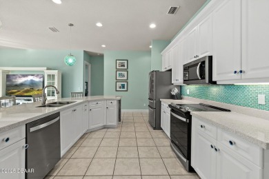 Welcome to this beautifully maintained 4-bedroom, 2-bathroom on Plantation Bay Golf and Country Club in Florida - for sale on GolfHomes.com, golf home, golf lot