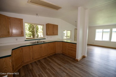 Located on a quiet half-acre lot with 100 feet of Lamb Creek on Priest Lake Golf and Tennis Club in Idaho - for sale on GolfHomes.com, golf home, golf lot
