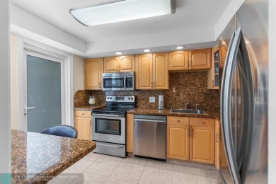Enjoy a Serene Lake View from this Super Clean, Bright 2nd Floor on Palm-Aire Country Club and Resort - Palms in Florida - for sale on GolfHomes.com, golf home, golf lot