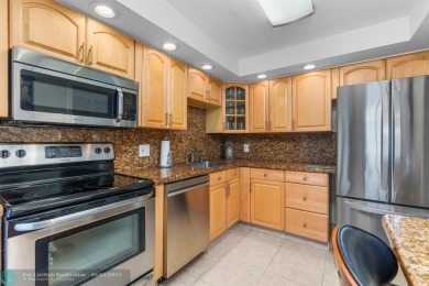 Enjoy a Serene Lake View from this Super Clean, Bright 2nd Floor on Palm-Aire Country Club and Resort - Palms in Florida - for sale on GolfHomes.com, golf home, golf lot