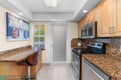 Enjoy a Serene Lake View from this Super Clean, Bright 2nd Floor on Palm-Aire Country Club and Resort - Palms in Florida - for sale on GolfHomes.com, golf home, golf lot