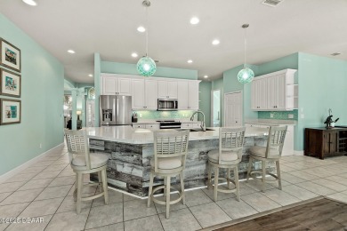 Welcome to this beautifully maintained 4-bedroom, 2-bathroom on Plantation Bay Golf and Country Club in Florida - for sale on GolfHomes.com, golf home, golf lot