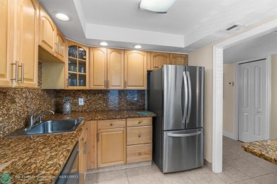 Enjoy a Serene Lake View from this Super Clean, Bright 2nd Floor on Palm-Aire Country Club and Resort - Palms in Florida - for sale on GolfHomes.com, golf home, golf lot